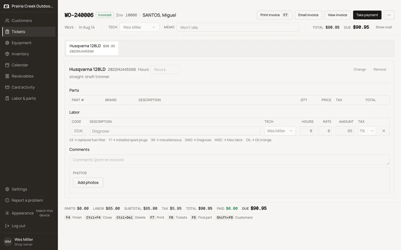 An invoiced ticket header with Take payment and the amount still due. Sample shop. Made-up names and tickets.